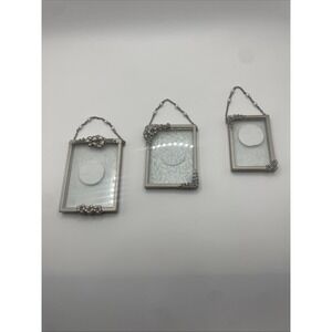 set of three glass and metal hanging photo frames.